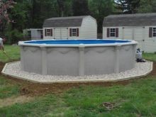 Round Pool with the 4 x 4 Pressure treated Outline landscaping with white marble chips