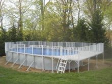 18' x 33' Oval Pool with a End Aluminum Deck and a Safety Fence Surround